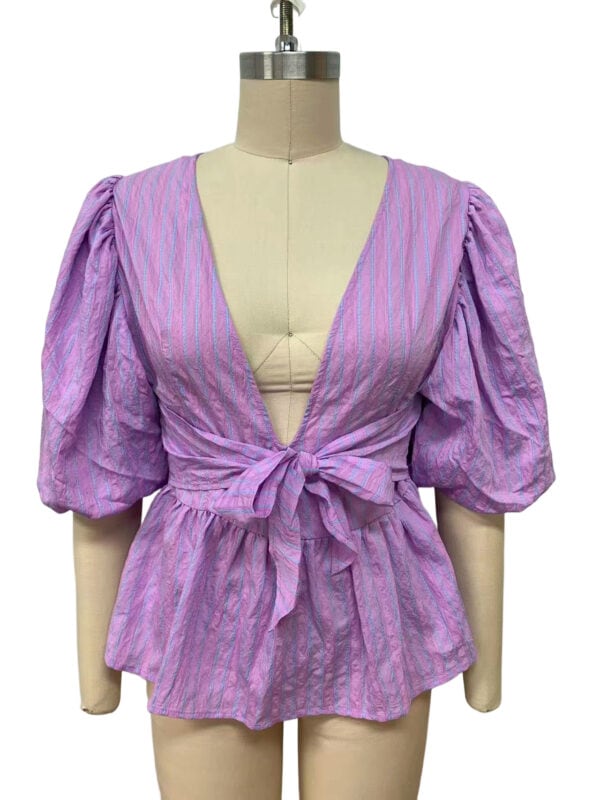 Colorful women's blouse with puff sleeves, deep V-neck, and front tie knot, perfect for summer fashion and casual outings.