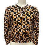 Stylish women's blouse with a bold geometric pattern in black, beige, and brown, featuring a round neckline with a tie detail and elasticized hem for a comfortable fit.