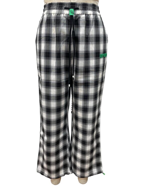 Comfortable black and white plaid pajama pants with elastic waistband and drawstring, perfect for loungewear or sleepwear.