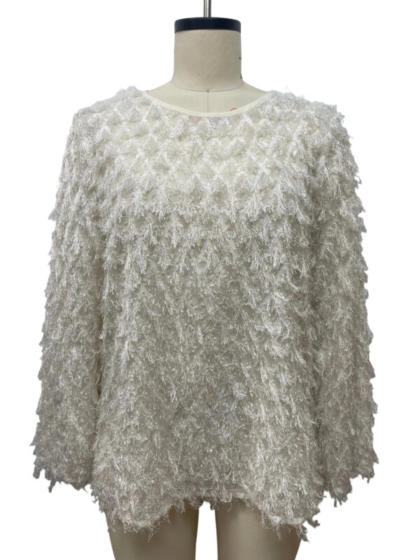 White textured women's sweater with a fluffy, layered design, perfect for winter fashion and cozy style.