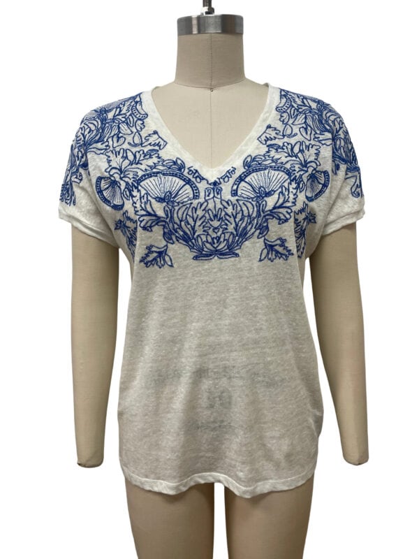Women's casual top with intricate blue embroidery on the neckline and shoulders, made from lightweight fabric, perfect for summer wear.
