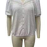 White eyelet blouse with puff sleeves and button front, perfect for casual or semi-formal occasions, made from breathable fabric.