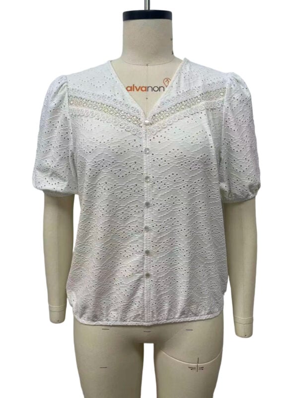 White eyelet blouse with puff sleeves and button front, perfect for casual or semi-formal occasions, made from breathable fabric.