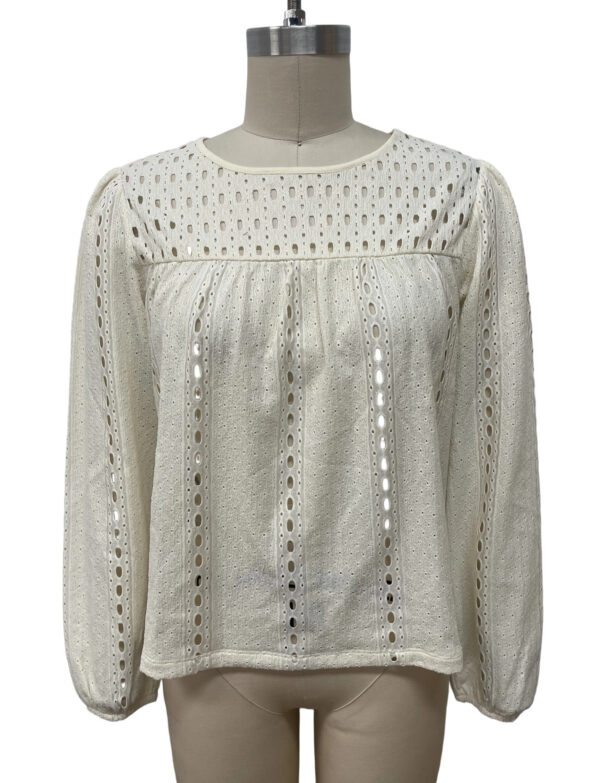 White eyelet blouse with long sleeves and intricate cut-out patterns, perfect for casual or semi-formal occasions, showcasing stylish and breathable fabric.