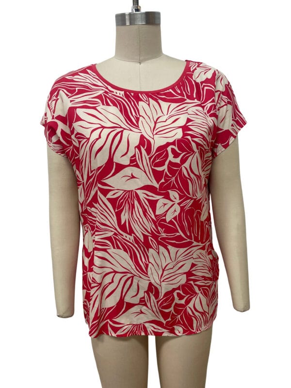 Stylish red and white leaf print blouse with short sleeves, perfect for casual or summer wear, displayed on a mannequin.