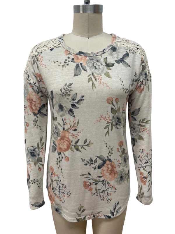 Elegant floral long sleeve women's top with lace shoulder details, perfect for casual or semi-formal occasions.