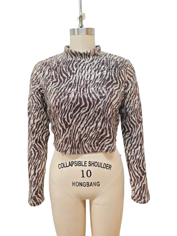 Stylish animal print long sleeve top with high neckline, perfect for fashion-forward women, displayed on a mannequin with a collapsible shoulder feature.