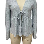Light gray lace women's top with V-neck and bow tie detail, perfect for stylish casual or formal wear.