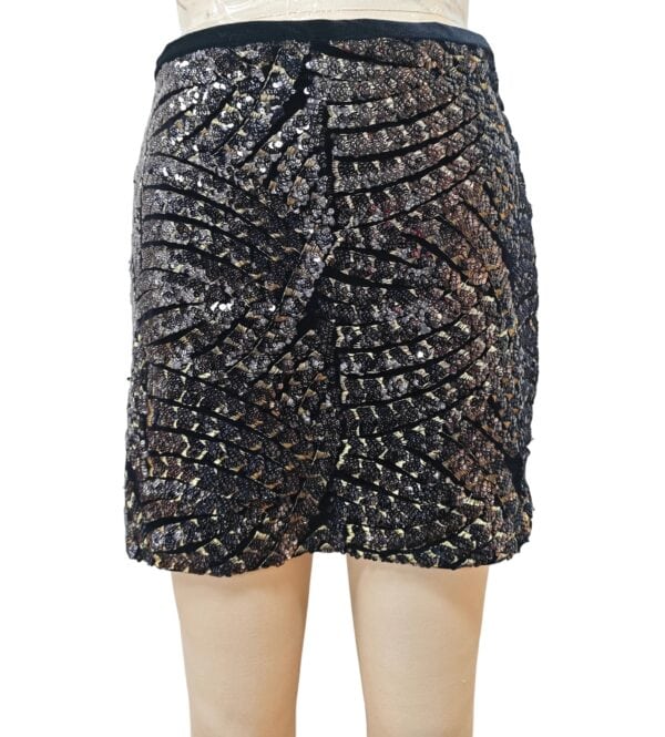 Elegant black mini skirt adorned with shimmering gold and silver sequins, perfect for evening wear or special occasions.