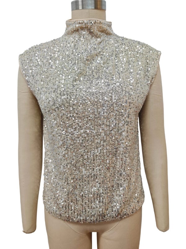 Shimmering sleeveless top covered in silver sequins, perfect for evening wear or special occasions, displayed on a mannequin.