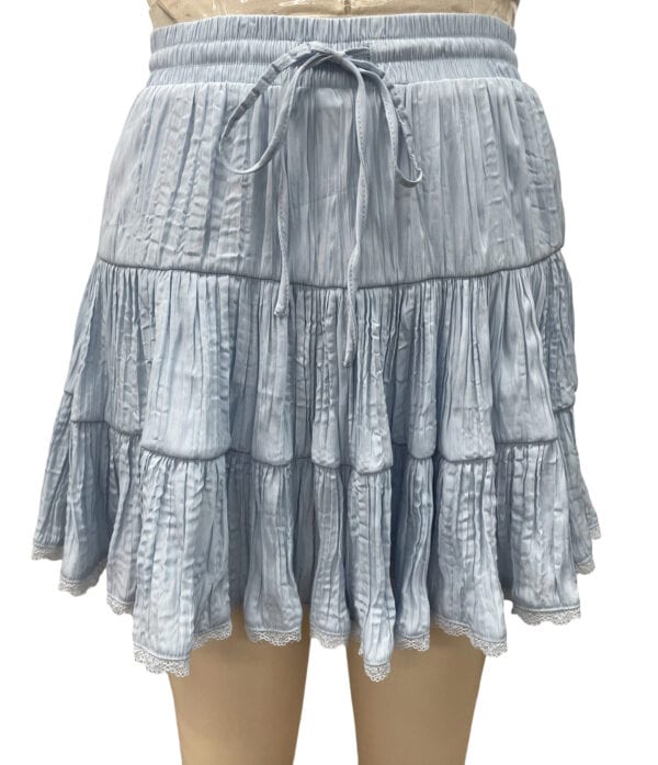 Light blue tiered ruffle skirt with elastic waistband and drawstring, perfect for casual summer wear and beach outings.