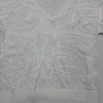 White lace sweater with floral pattern, lightweight and stylish for casual or dressy occasions.