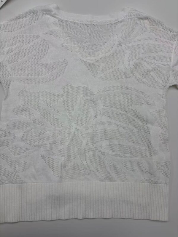 White lace sweater with floral pattern, lightweight and stylish for casual or dressy occasions.