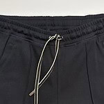 Close-up of black jogger pants with drawstring waist, suitable for casual and athletic outfits.