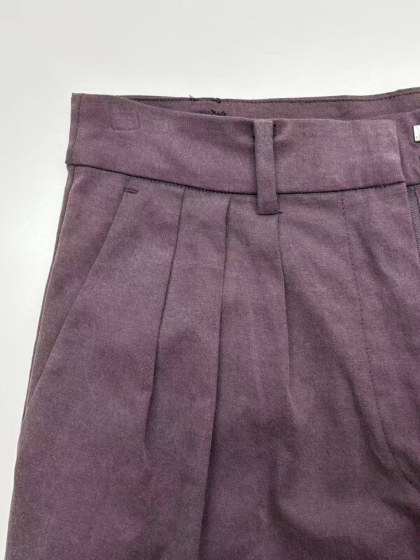 Elegant purple women's trousers with pleats and belt loops, suitable for office or casual wear, made from comfortable fabric.