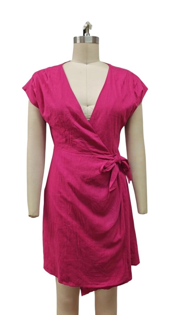 Bright pink women's wrap dress with short sleeves and a side tie, perfect for summer or casual outings.