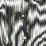 Close-up of a men's dress shirt with vertical stripes in white, purple, and green, featuring white buttons along the front placket.