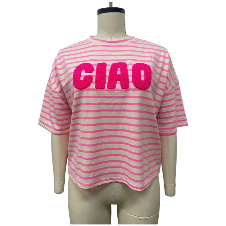 Pink and white striped casual T-shirt with bold 'CIAO' text across the chest, displayed on a mannequin for fashion showcase.