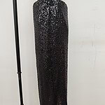 Black sequin maxi skirt for women, stylish evening wear, perfect for parties and special occasions.