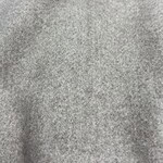 Close-up of soft grey fabric texture suitable for fashion and clothing design.