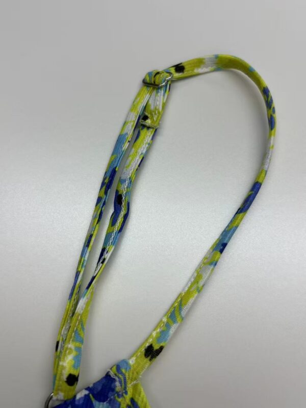 Vibrant fabric necklace with blue, green, and yellow patterns, perfect for stylish accessories and fashion statements.