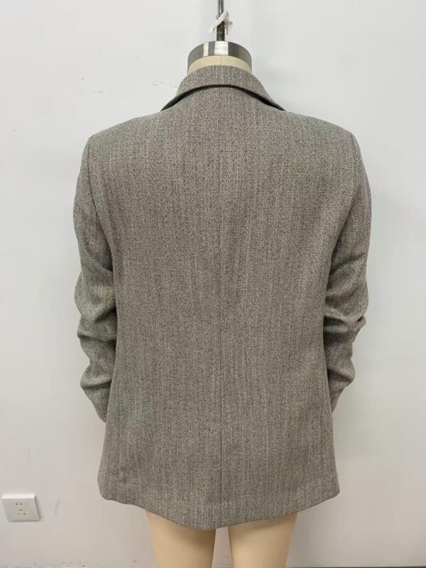 A stylish women's blazer in a classic grey check pattern, perfect for professional or formal occasions, displayed on a mannequin against a plain white background.
