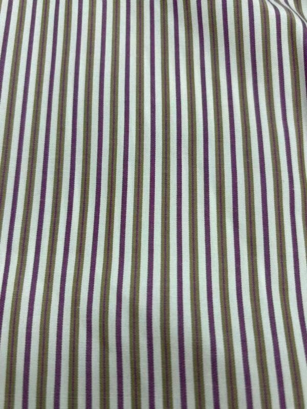 Close-up of striped fabric with green, purple, and beige vertical lines, suitable for clothing or accessories.