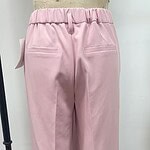 Stylish pink women's trousers with a high waist and tailored fit, featuring back pockets and a comfortable elastic waistband, perfect for casual or office wear.