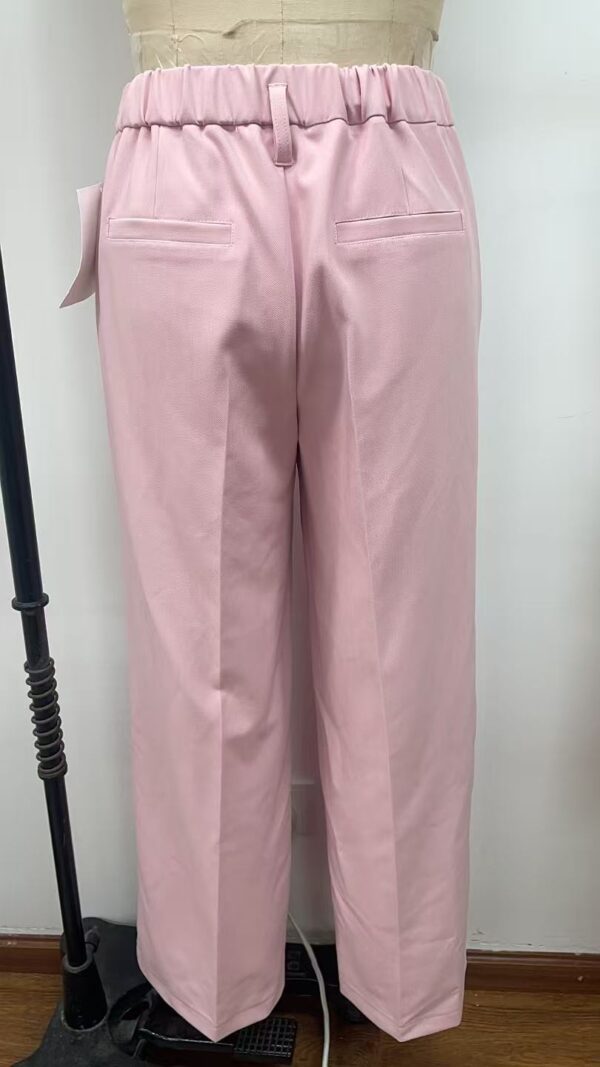 Stylish pink women's trousers with a high waist and tailored fit, featuring back pockets and a comfortable elastic waistband, perfect for casual or office wear.