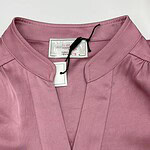 Stylish pink women's blouse with a mandarin collar and subtle pleats, perfect for casual or office wear, displayed on a white background.