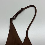 Stylish brown shoulder bag with adjustable strap, perfect for casual and formal outfits, made from durable fabric for everyday use.