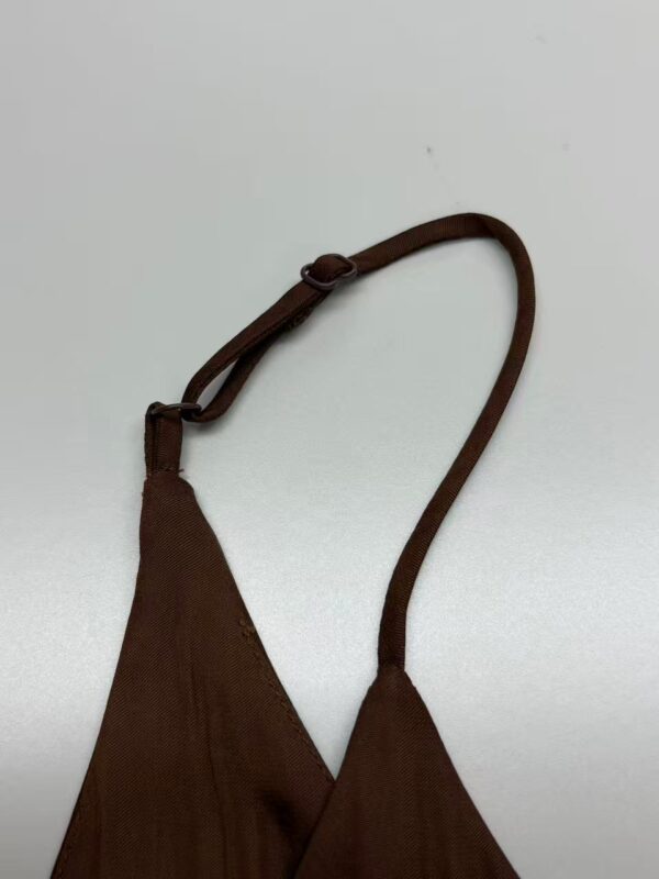 Stylish brown shoulder bag with adjustable strap, perfect for casual and formal outfits, made from durable fabric for everyday use.