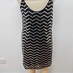 Stylish black and silver sequin dress with spaghetti straps, perfect for evening wear or special occasions.