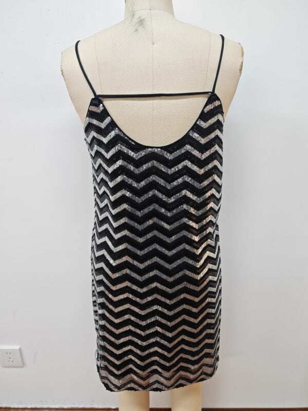 Stylish black and silver sequin dress with spaghetti straps, perfect for evening wear or special occasions.