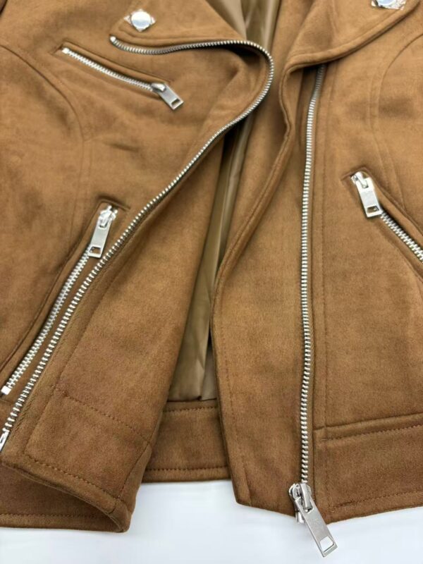 Close-up of two brown leather jackets with silver zippers, showcasing fashionable outerwear for men.