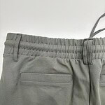 Close-up of gray casual pants with elastic waistband and back pocket, suitable for everyday wear and comfortable fashion.