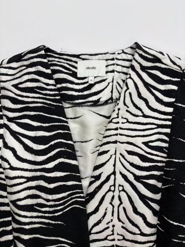 Stylish black and white zebra print blazer for women, perfect for casual or formal wear, made from high-quality fabric, available at nbfish-fashion.com.