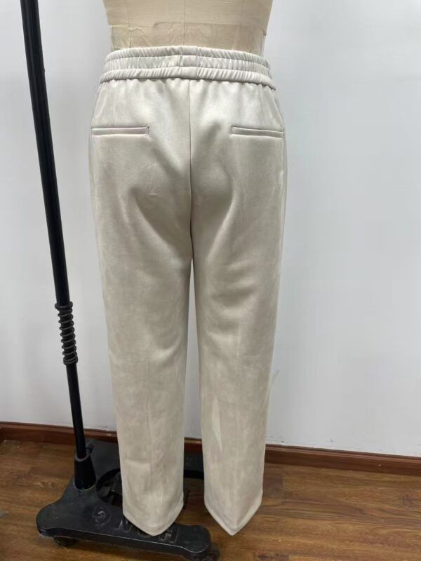 Comfortable beige sweatpants with elastic waistband and back pockets, perfect for casual wear and lounging.