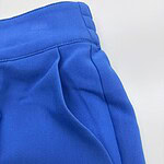 Close-up of vibrant blue casual pants showing waistband and pocket details, perfect for everyday wear and stylish comfort.