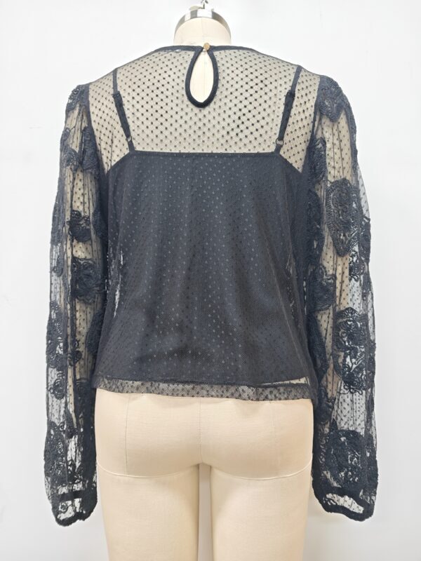 Elegant black lace blouse with sheer polka dot fabric and floral lace sleeves, perfect for stylish occasions and evening wear.