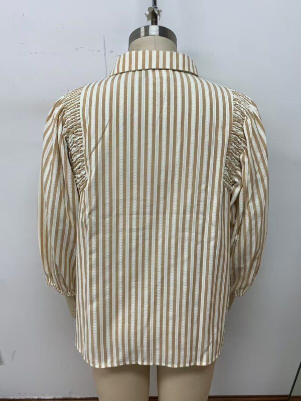 Elegant women's button-up shirt with vertical beige and white stripes, featuring puffed sleeves and a classic collar, perfect for casual or office wear.