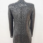 Black long-sleeve sequin dress with a fitted silhouette, perfect for evening events and parties, showcasing a glamorous and stylish look.