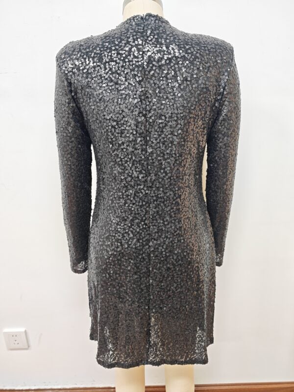 Black long-sleeve sequin dress with a fitted silhouette, perfect for evening events and parties, showcasing a glamorous and stylish look.