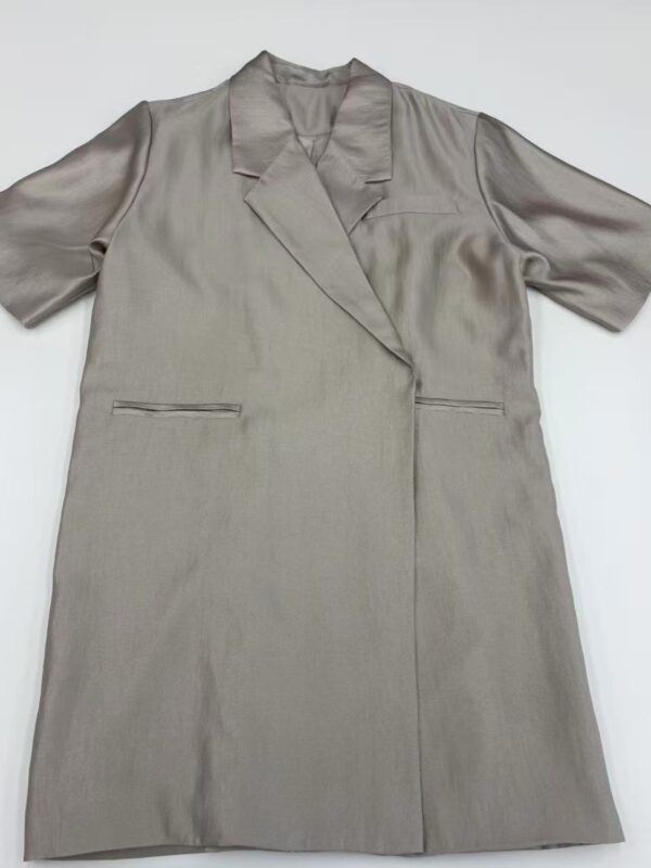 Luxurious beige satin coat with a sleek design, featuring a lapel collar and long sleeves, perfect for formal or casual wear.