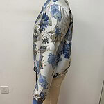 Elegant satin bomber jacket with blue floral embroidery, ribbed collar, cuffs, and hem, perfect for stylish casual wear.