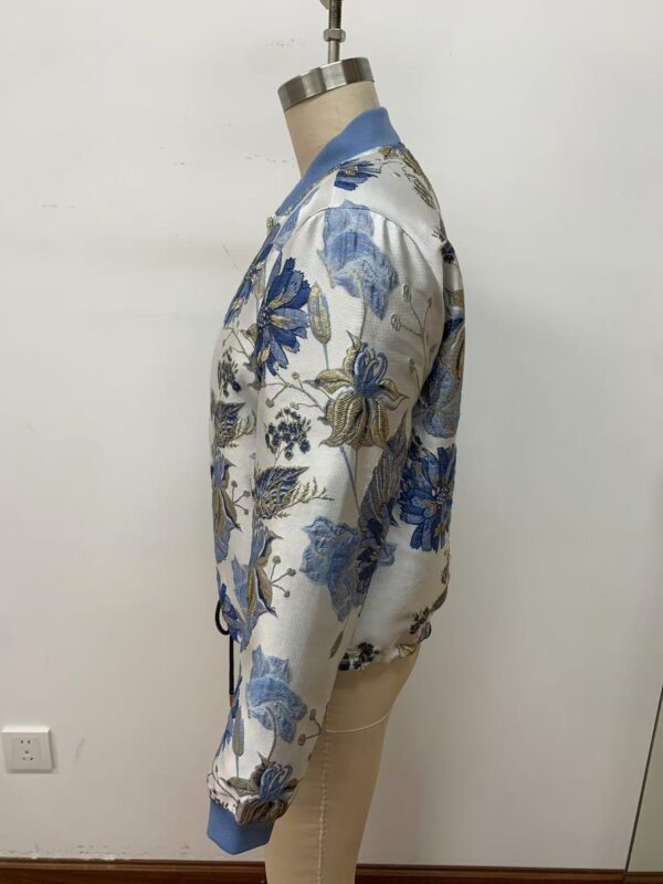Elegant satin bomber jacket with blue floral embroidery, ribbed collar, cuffs, and hem, perfect for stylish casual wear.