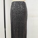 Stylish black maxi skirt adorned with sequins, perfect for evening wear or special occasions, showcasing a sleek and glamorous look.