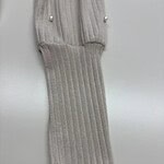 Close-up of a gray ribbed knit glove with pearl button details, showcasing high-quality craftsmanship and stylish design.