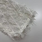 Close-up of delicate white lace fabric with intricate patterns, ideal for fashion and apparel design.