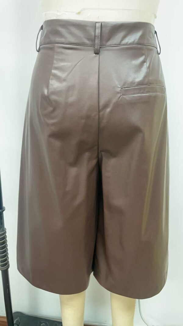 Stylish taupe leather shorts with a high waist and side pocket, perfect for casual or semi-formal occasions.